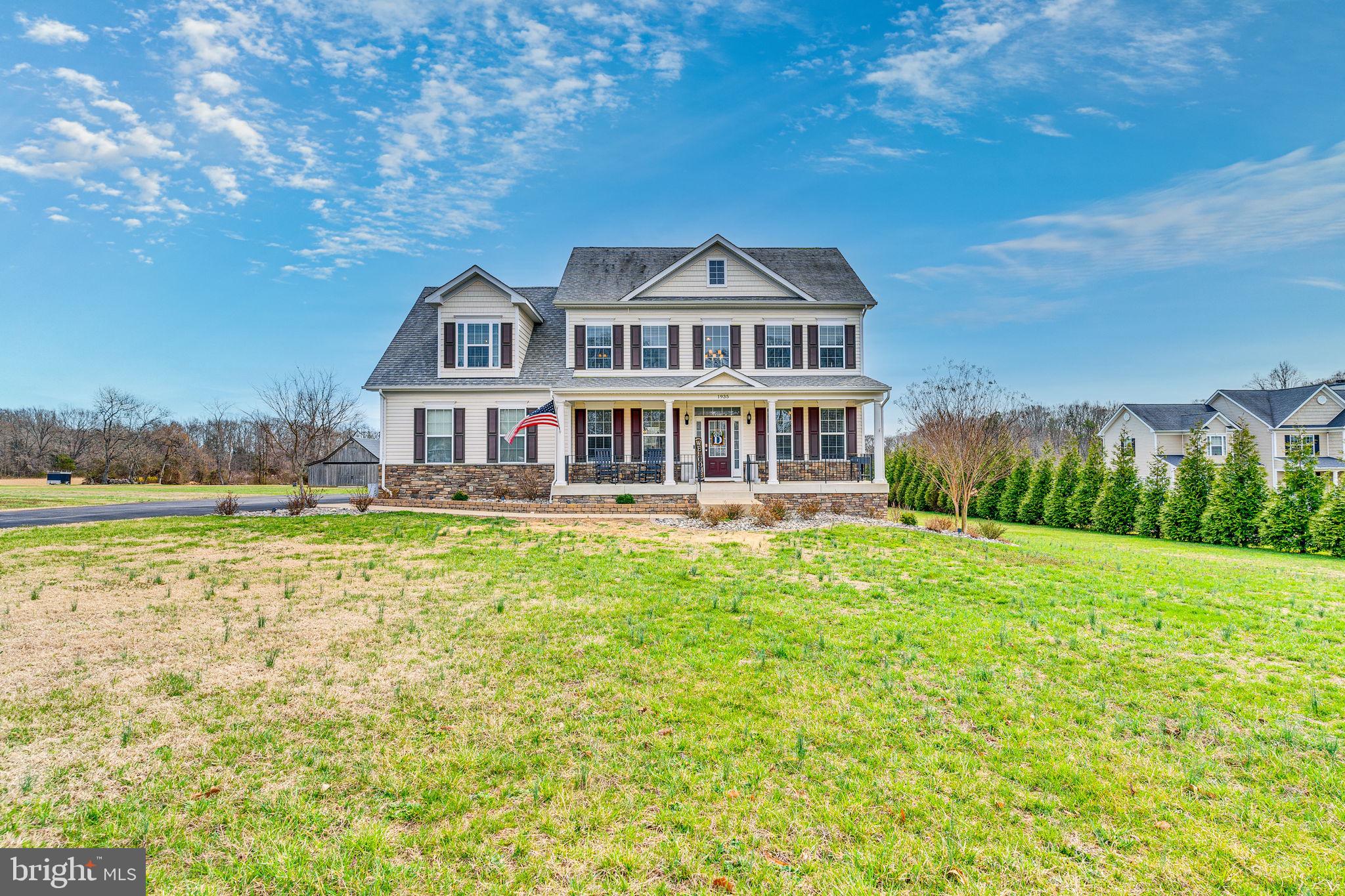 1935 Lowery Road Huntingtown, MD 20639 - Photo 4 of 65 a front view of a house with a garden