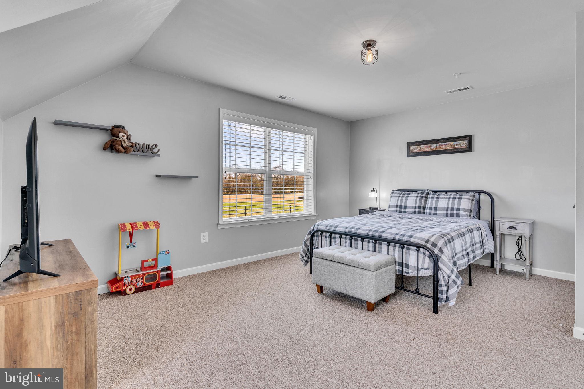 1935 Lowery Road Huntingtown, MD 20639 - Photo 42 of 65 a bedroom with a bed and a window