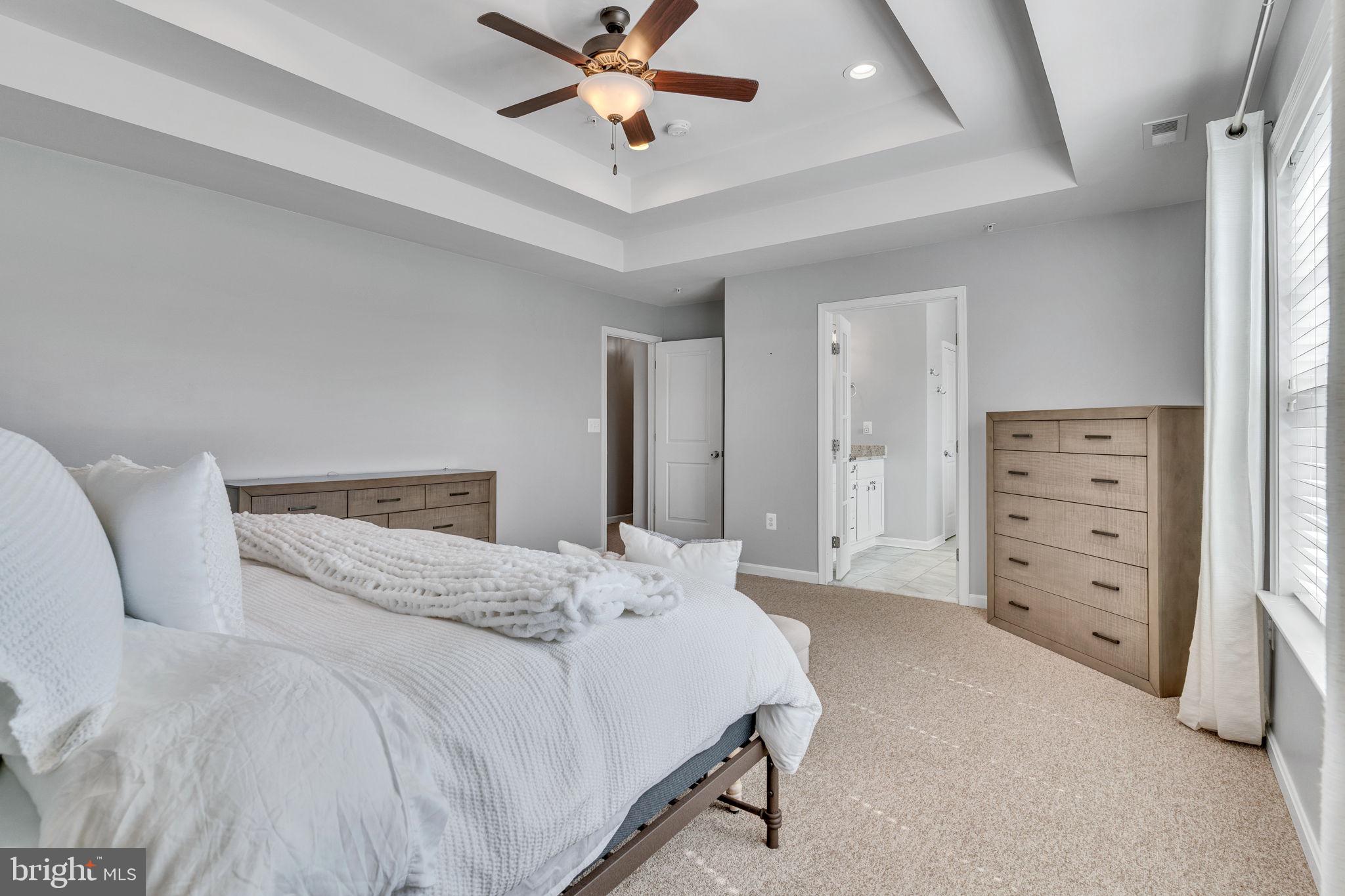 1935 Lowery Road Huntingtown, MD 20639 - Photo 46 of 65 a bedroom with a bed and a chandelier