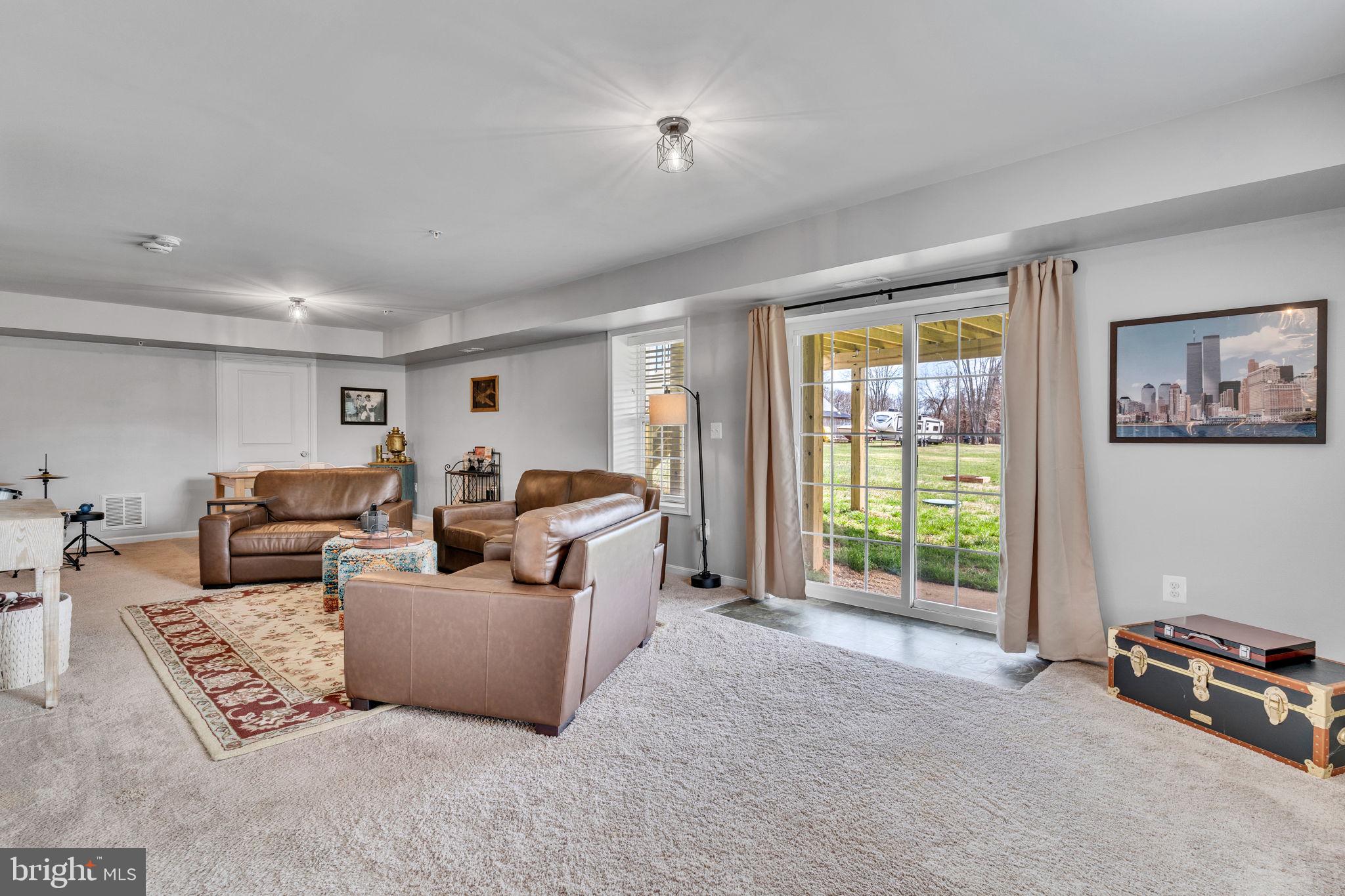 1935 Lowery Road Huntingtown, MD 20639 - Photo 53 of 65 a living room with furniture and a flat screen tv