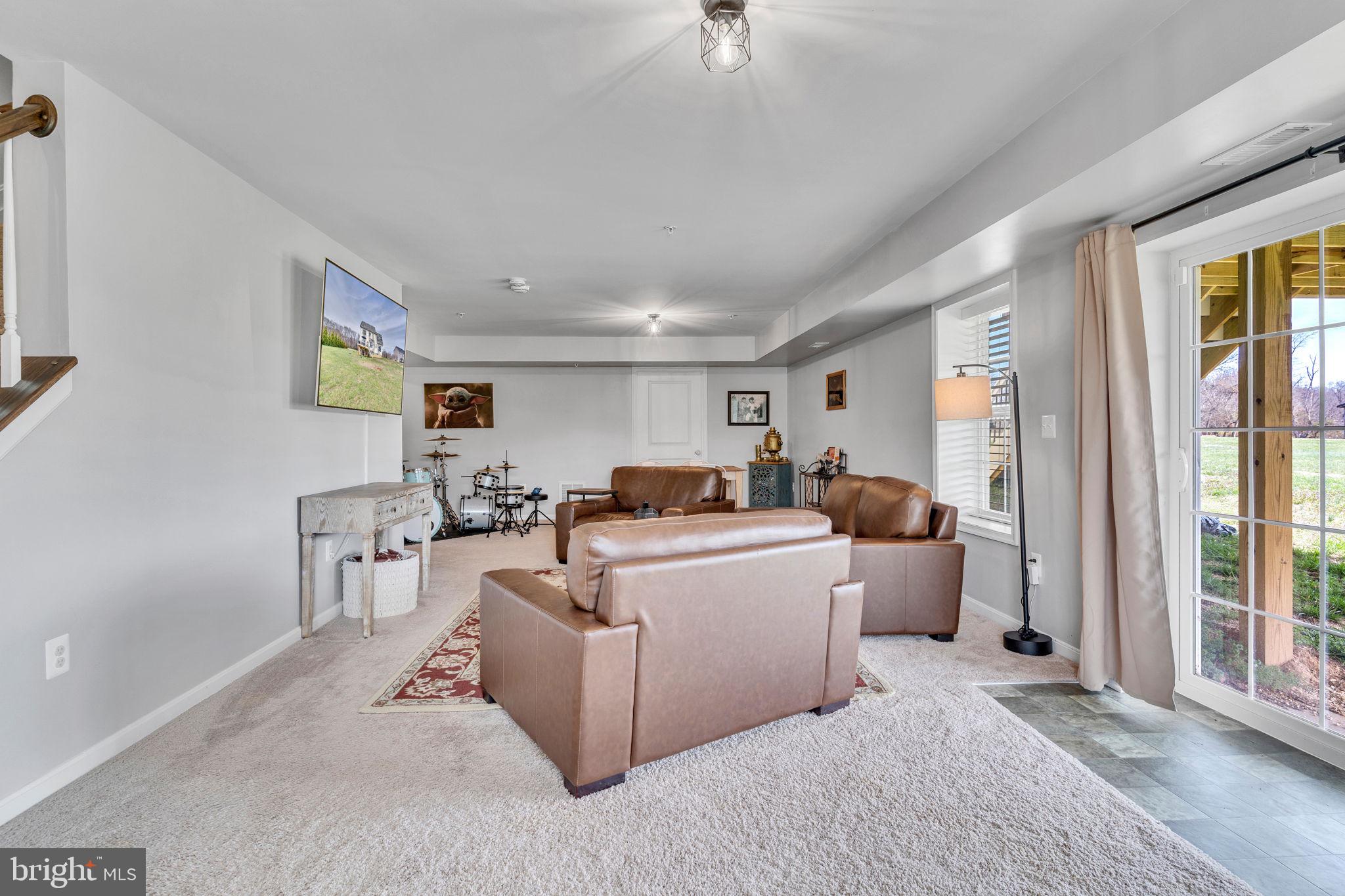 1935 Lowery Road Huntingtown, MD 20639 - Photo 54 of 65 a living room with furniture and a window