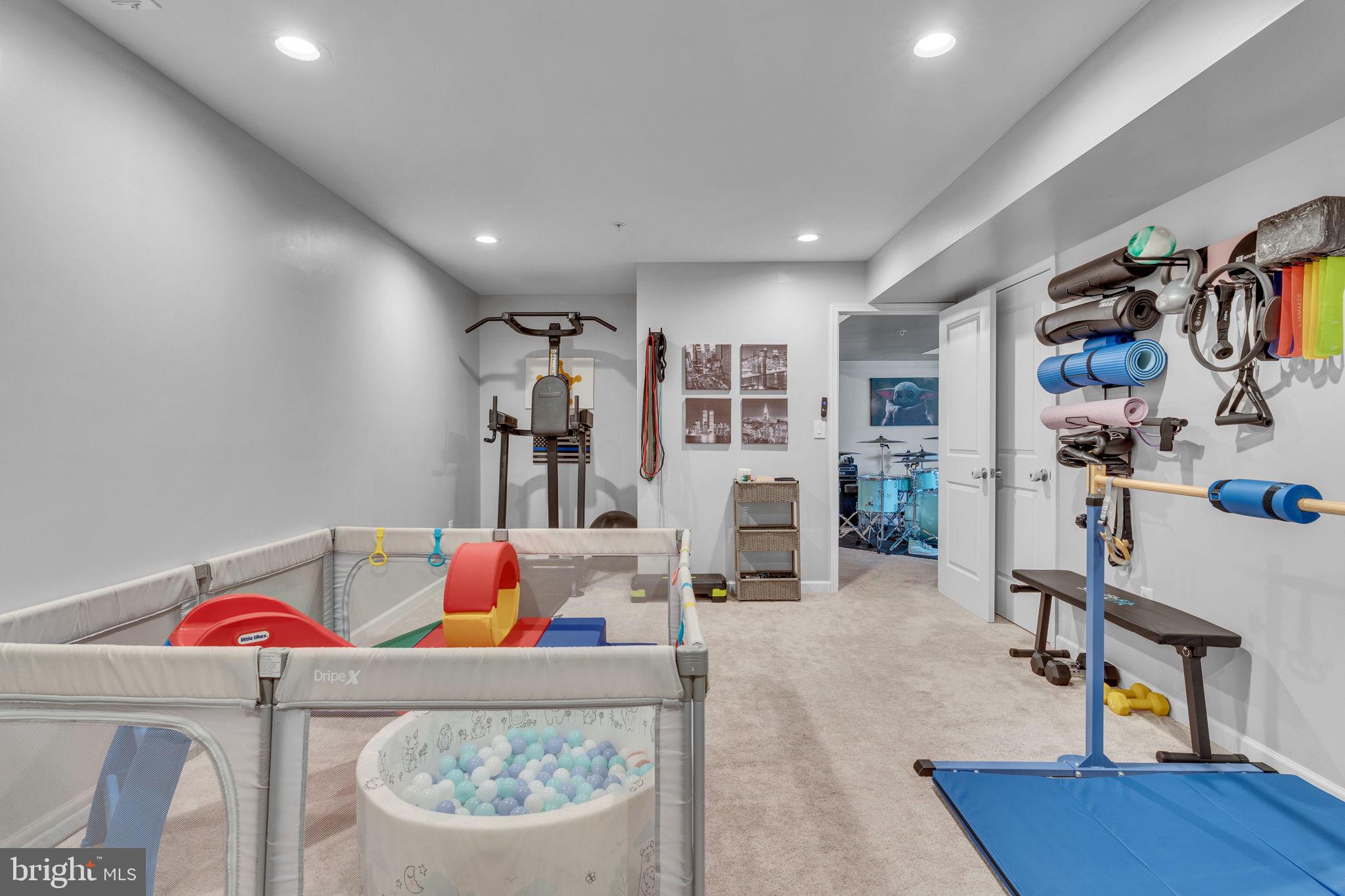 1935 Lowery Road Huntingtown, MD 20639 - Photo 59 of 65 a living room with furniture and a flat screen tv