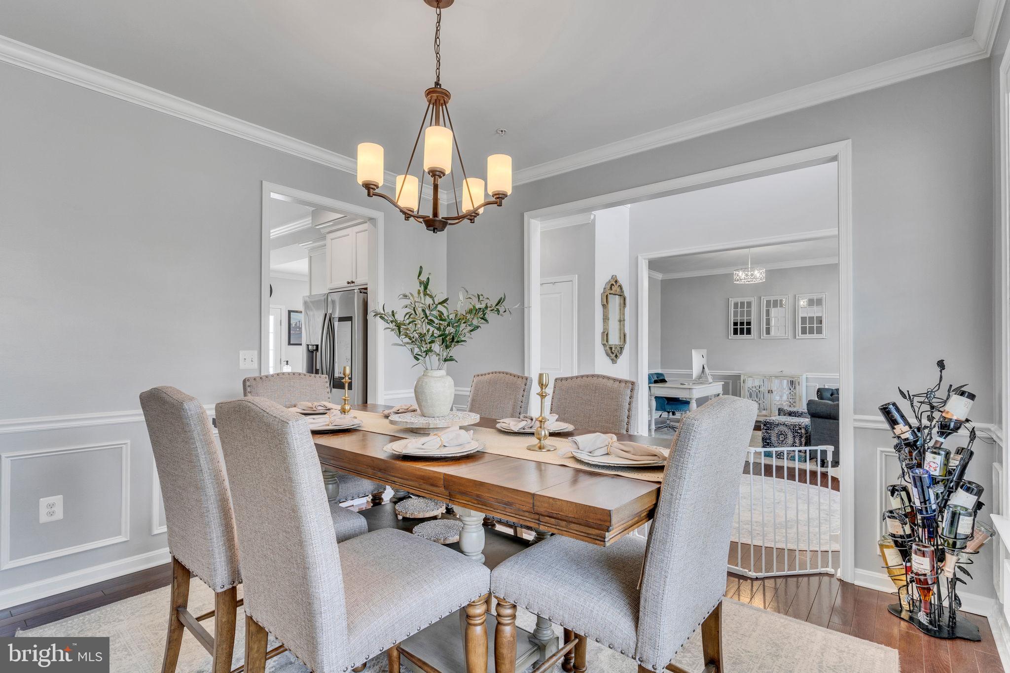 1935 Lowery Road Huntingtown, MD 20639 - Photo 10 of 65 a view of a dining room with furniture wooden floor and chandelier