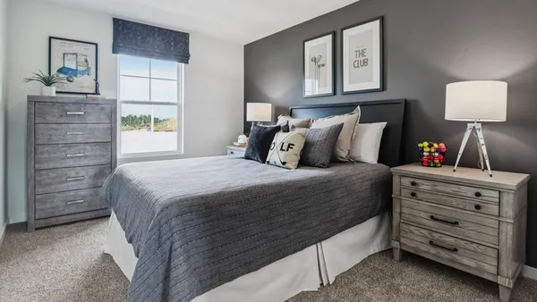 a bedroom with a bed and a closet
