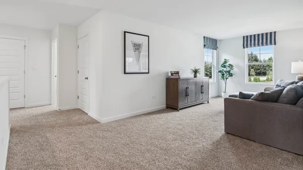 a living room with furniture and window