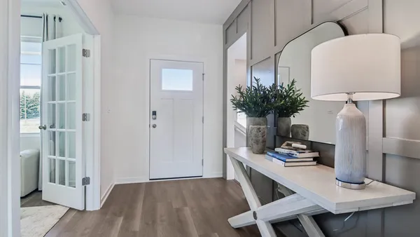 a view of kitchen with cabinets and wooden floor