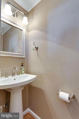 21053 Cornerpost Square Ashburn, VA 20147 - Photo 15 of 30 a bathroom with a sink and mirror