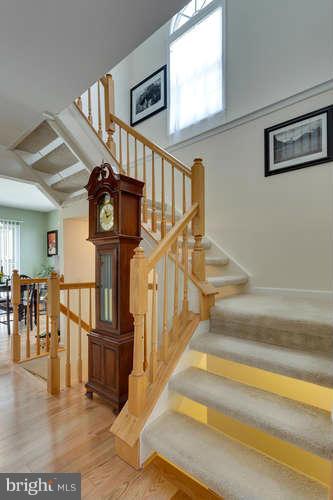21053 Cornerpost Square Ashburn, VA 20147 - Photo 16 of 30 a view of entryway and hall with wooden floor
