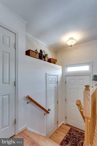 21053 Cornerpost Square Ashburn, VA 20147 - Photo 3 of 30 a view of a hallway with closet