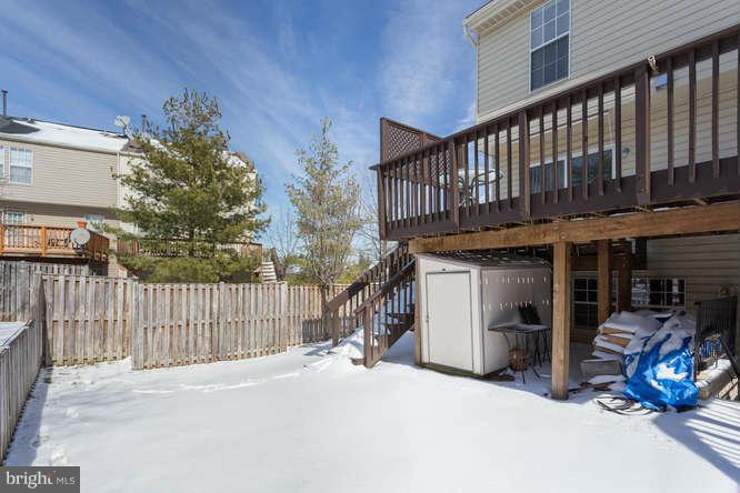 21053 Cornerpost Square Ashburn, VA 20147 - Photo 28 of 30 a view of a house with porch and furniture