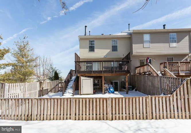 21053 Cornerpost Square Ashburn, VA 20147 - Photo 30 of 30 a view of a house with wooden deck