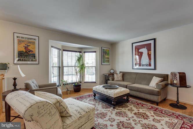 21053 Cornerpost Square Ashburn, VA 20147 - Photo 5 of 30 a living room with furniture and a large window