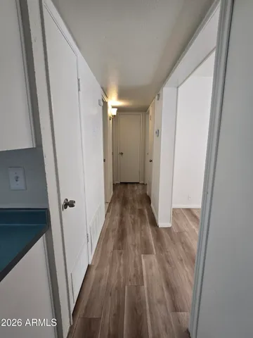 a view of an empty room with a ceiling fan