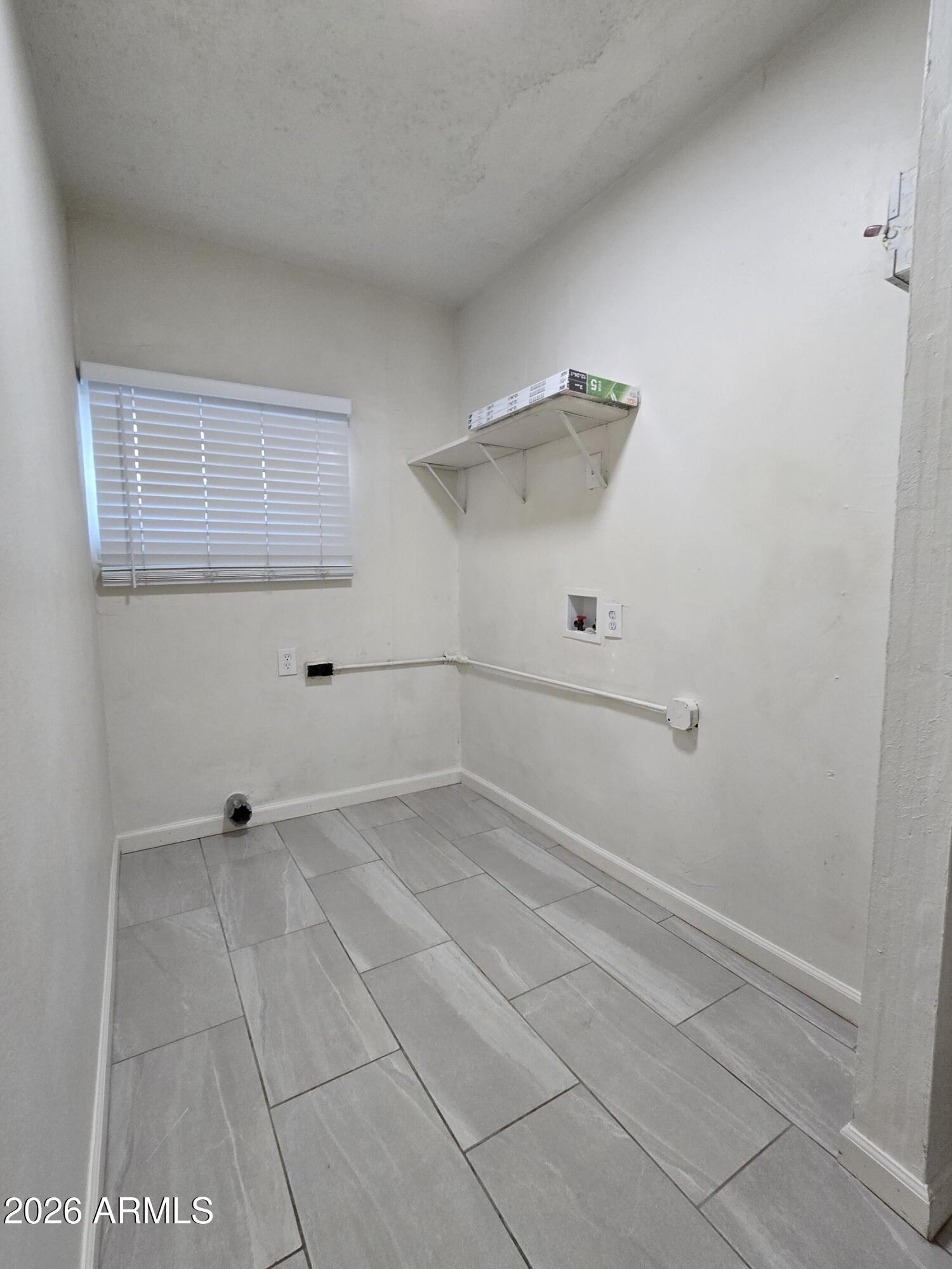 6512 North 41st Avenue Phoenix, AZ 85019 - Photo 22 of 24 a view of room with racks on the wall