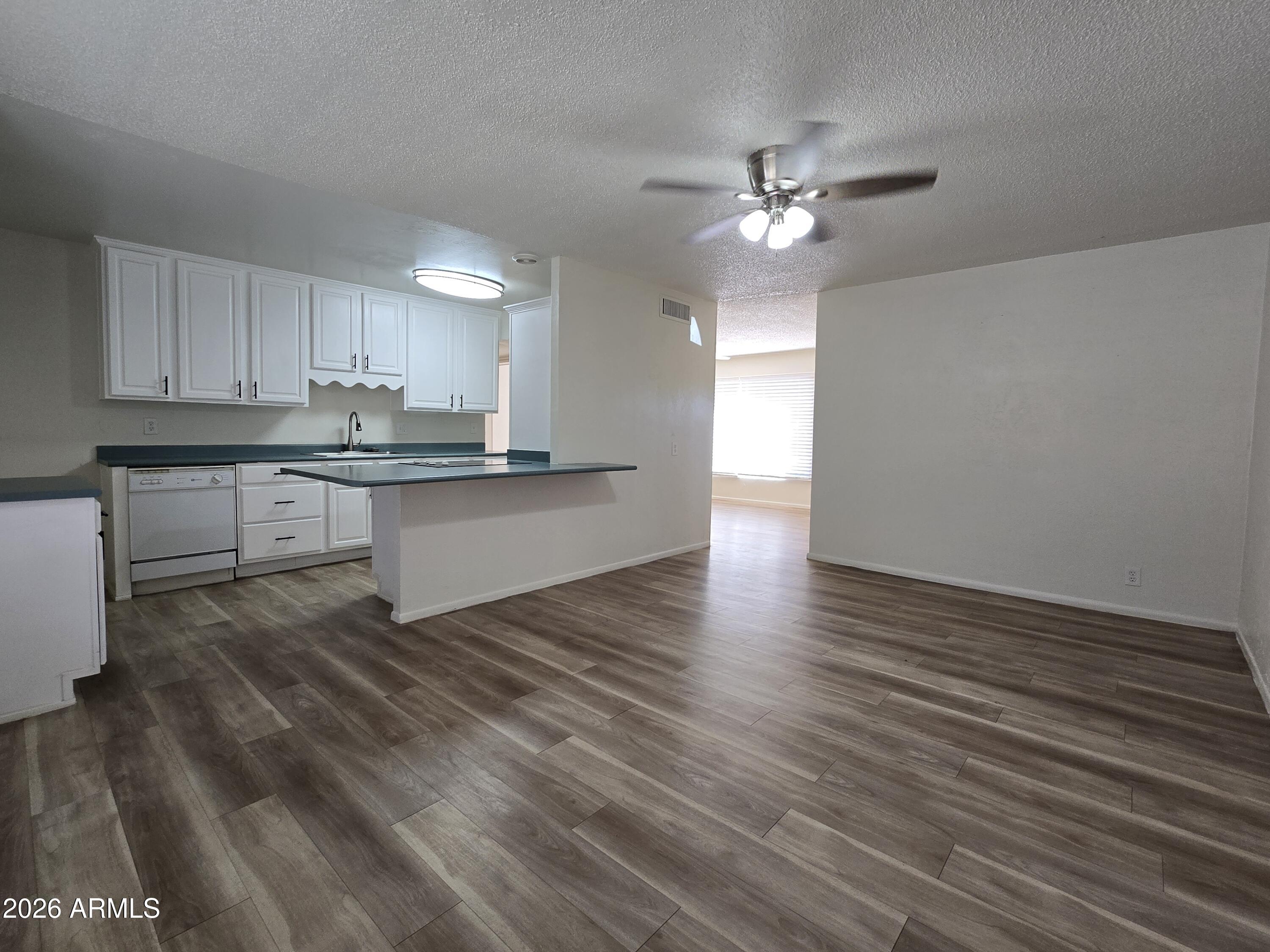 6512 North 41st Avenue Phoenix, AZ 85019 - Photo 7 of 24 a view of a kitchen with microwave and cabinets
