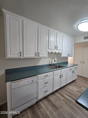 a kitchen with stainless steel appliances granite countertop a stove a refrigerator and a sink