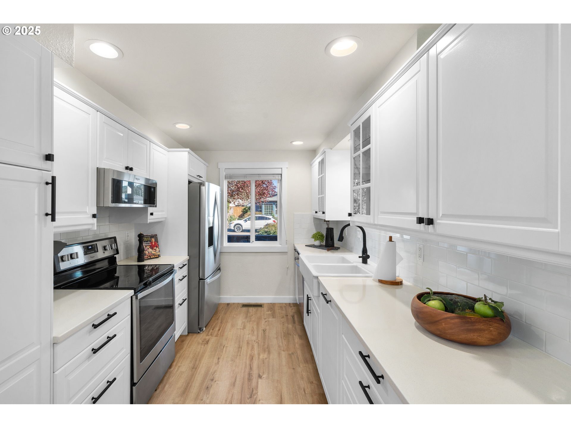 1905 Springbrook Way Newberg, OR 97132 - Photo 11 of 29 a kitchen with stainless steel appliances kitchen island granite countertop a sink dishwasher stove and cabinets