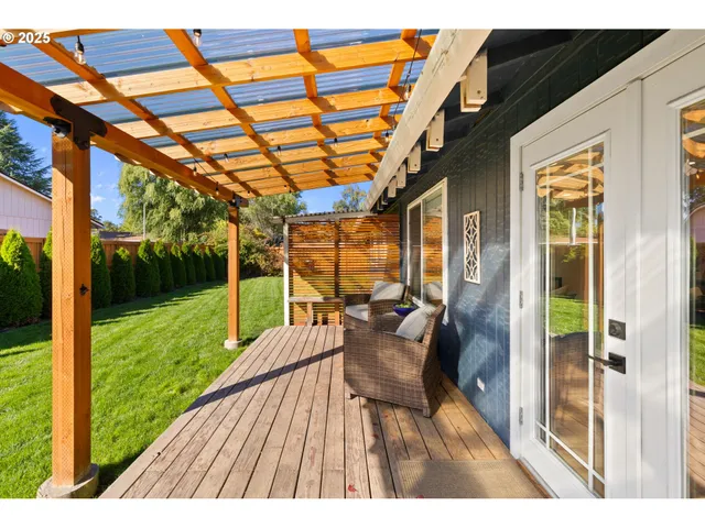 a living room with furniture and large window