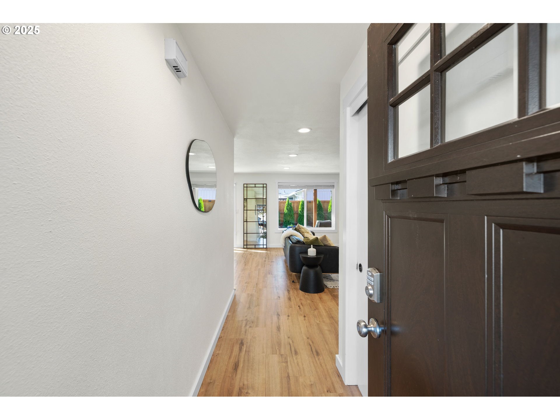 1905 Springbrook Way Newberg, OR 97132 - Photo 6 of 29 a picture of a room with a hanging light and hardwood floor