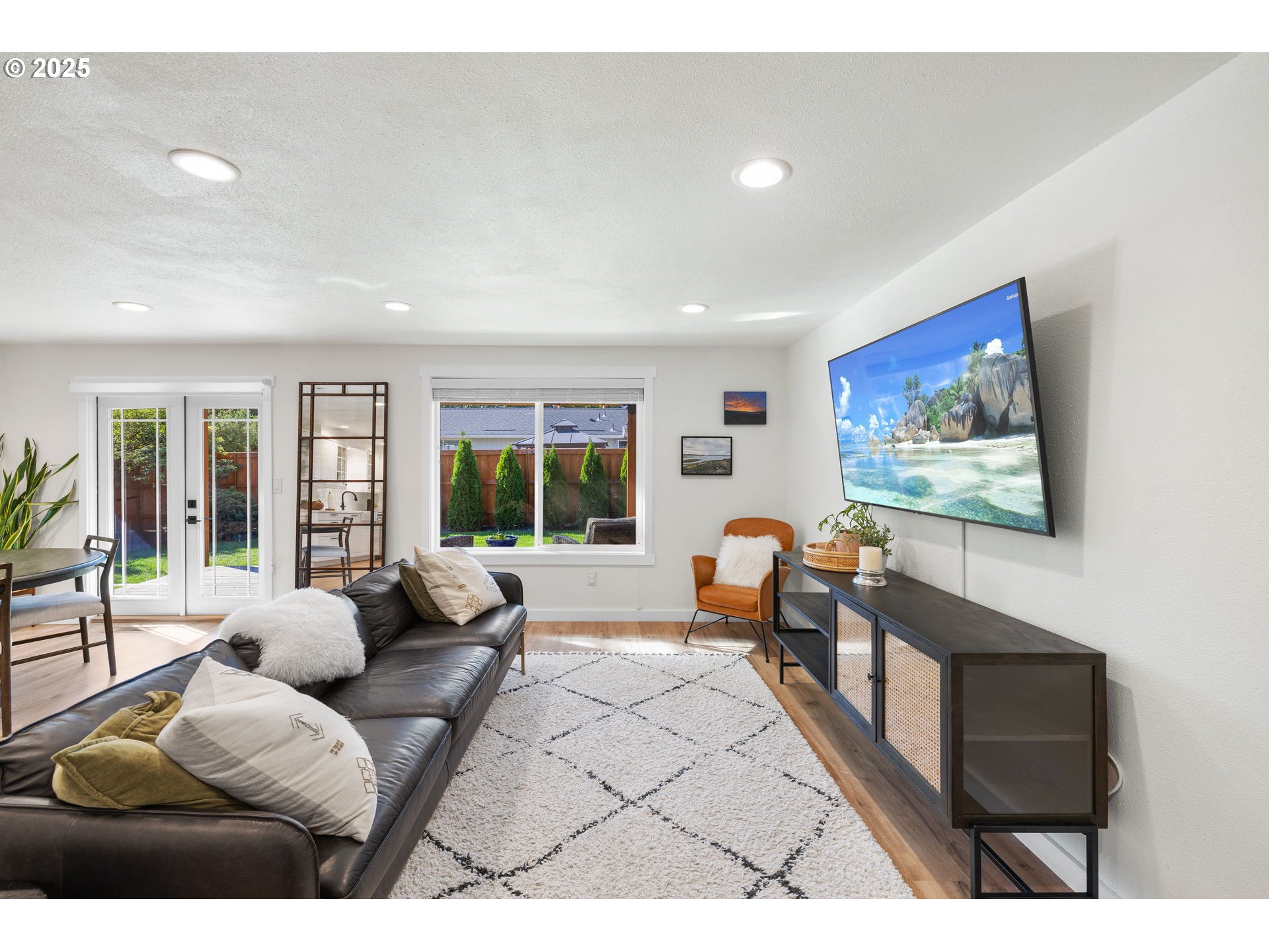 1905 Springbrook Way Newberg, OR 97132 - Photo 9 of 29 a living room with furniture two window and a flat screen tv