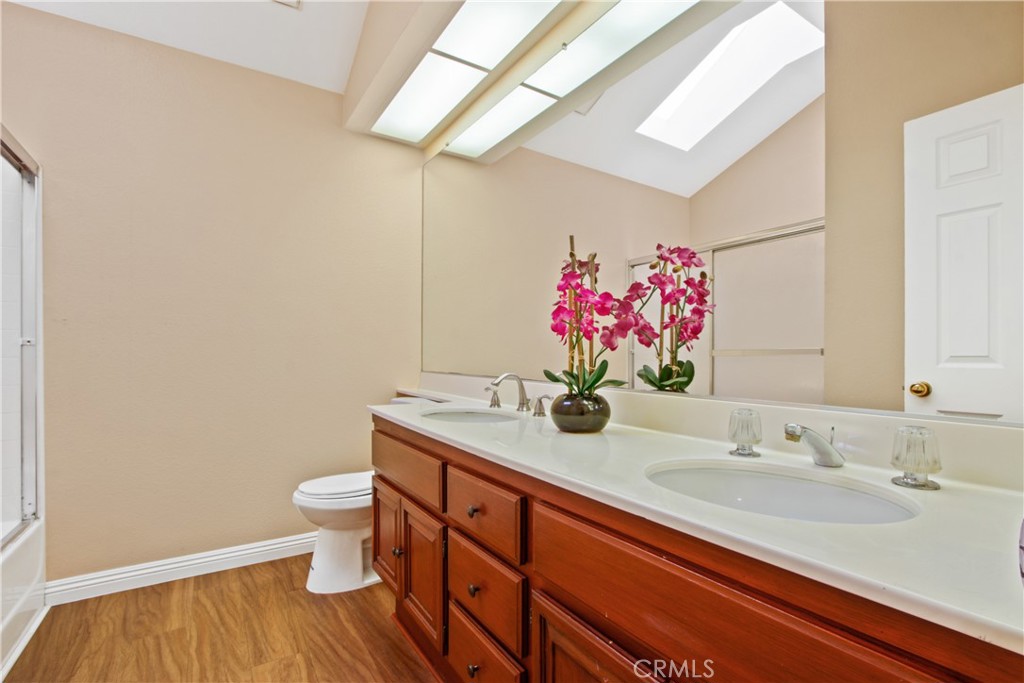 3117 Antler Road Ontario, CA 91761 - Photo 12 of 16 a bathroom with a sink and a mirror