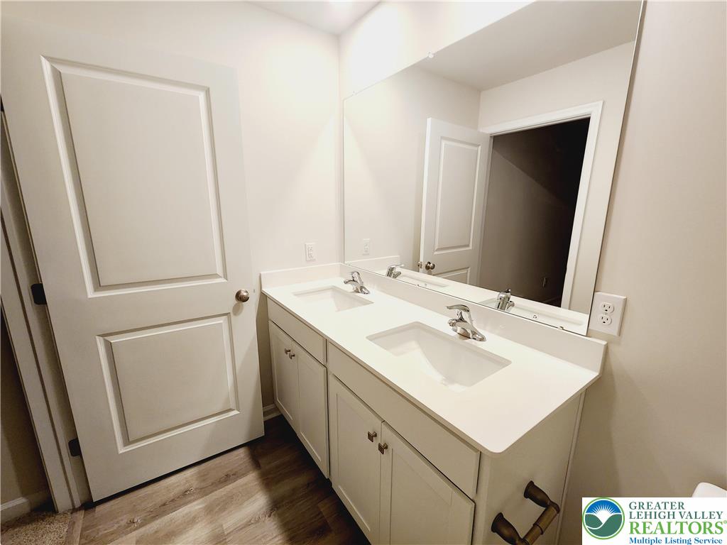 1104 Martin Road Breinigsville, PA 18031 - Photo 25 of 30 a bathroom with a sink and a mirror