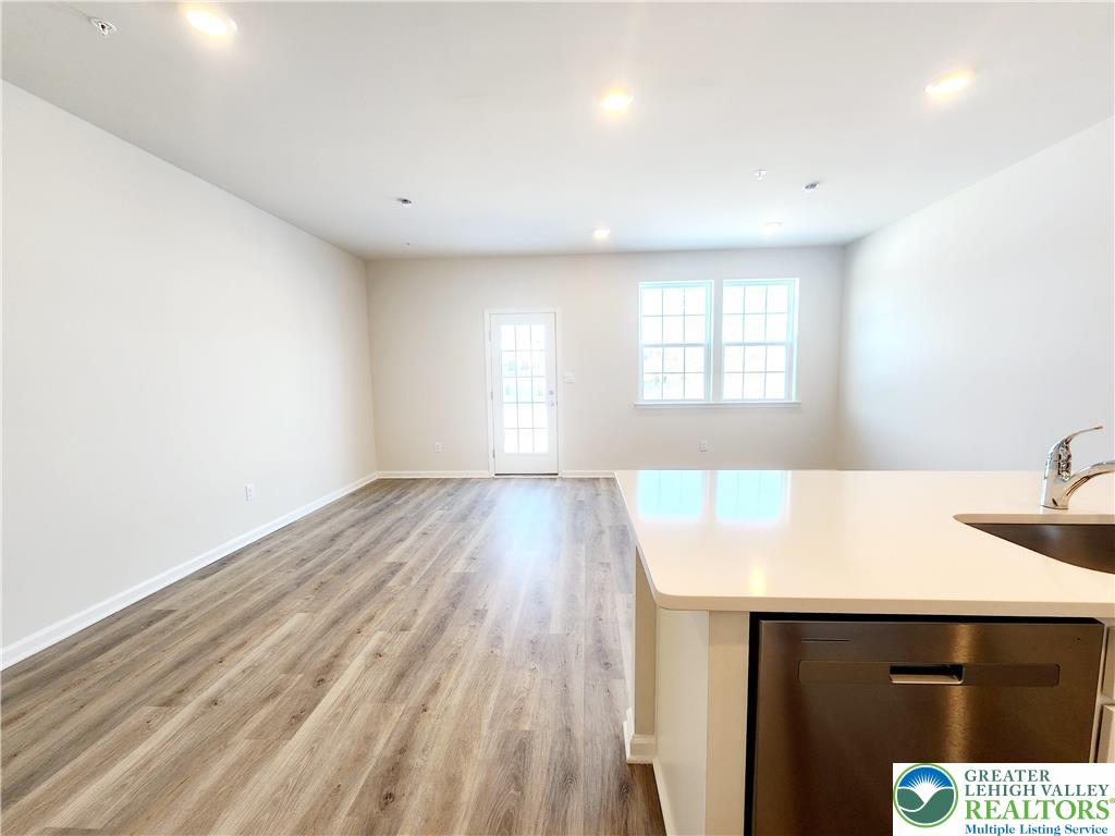 1104 Martin Road Breinigsville, PA 18031 - Photo 6 of 30 a view of a kitchen with wooden floor and staircase