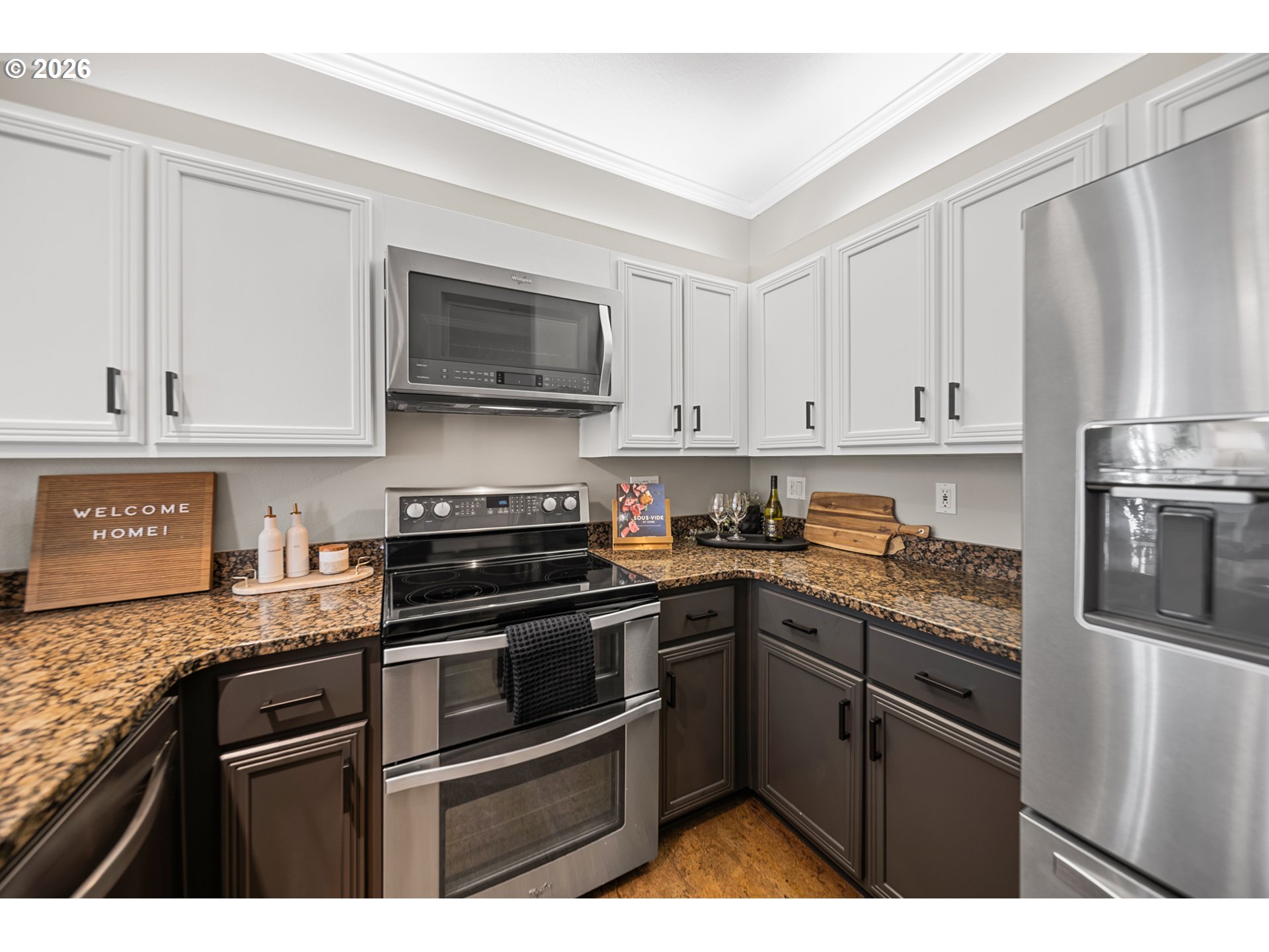 614 South Nevada Street, Unit B Portland, OR 97219 - Photo 13 of 29 a kitchen with stainless steel appliances granite countertop a stove top oven a sink dishwasher and a refrigerator