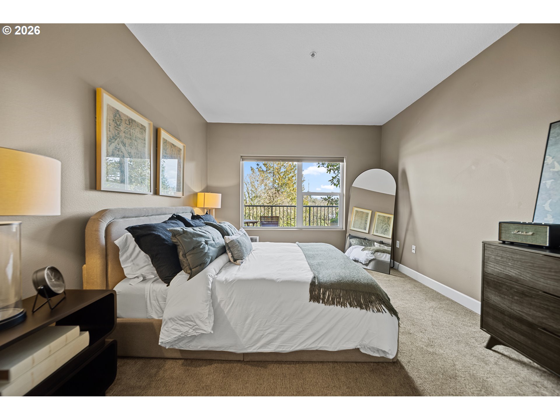 614 South Nevada Street, Unit B Portland, OR 97219 - Photo 17 of 29 a bedroom with a bed and wooden floor