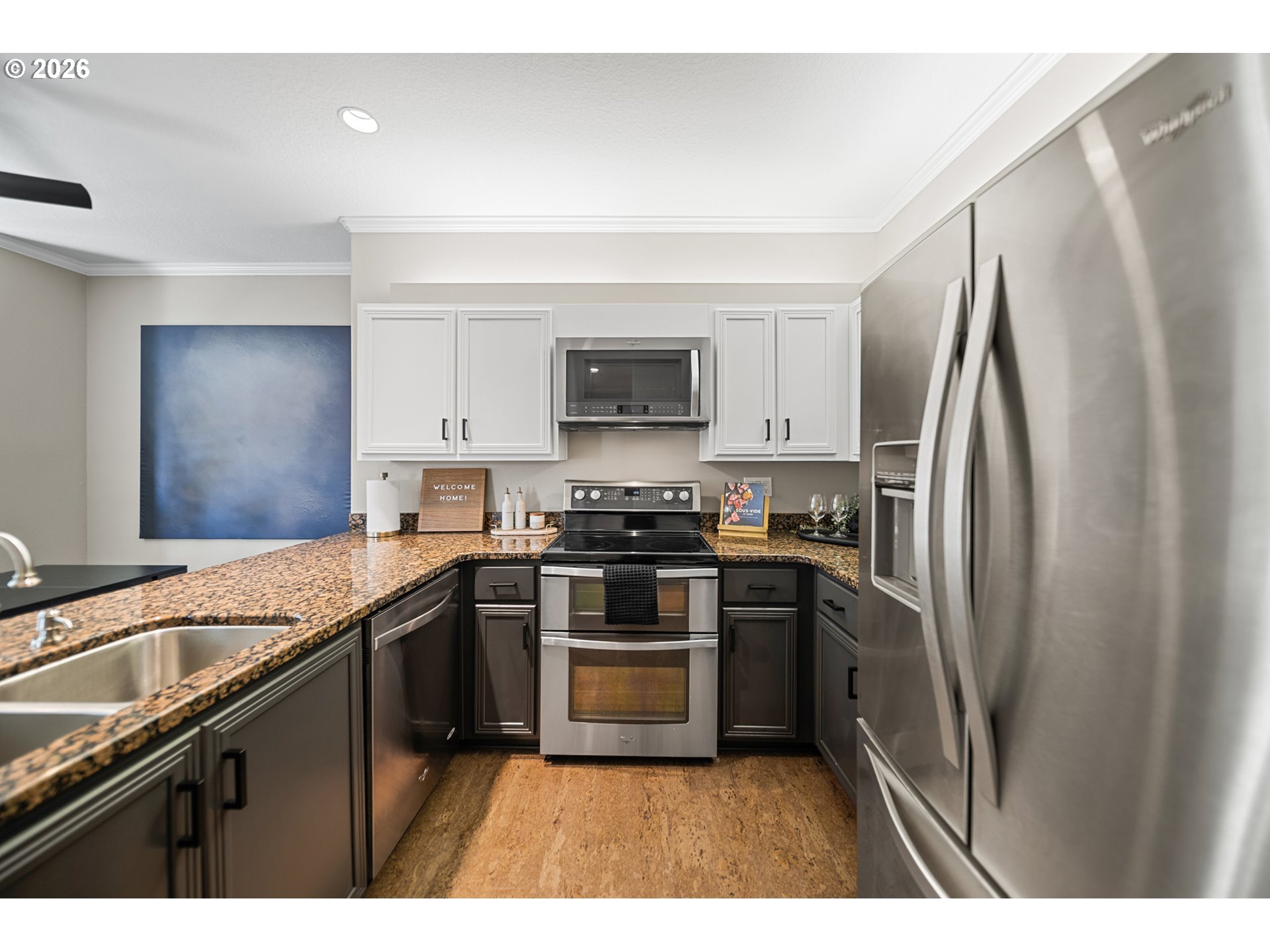 614 South Nevada Street, Unit B Portland, OR 97219 - Photo 8 of 29 a kitchen with stainless steel appliances granite countertop a stove a sink and a refrigerator
