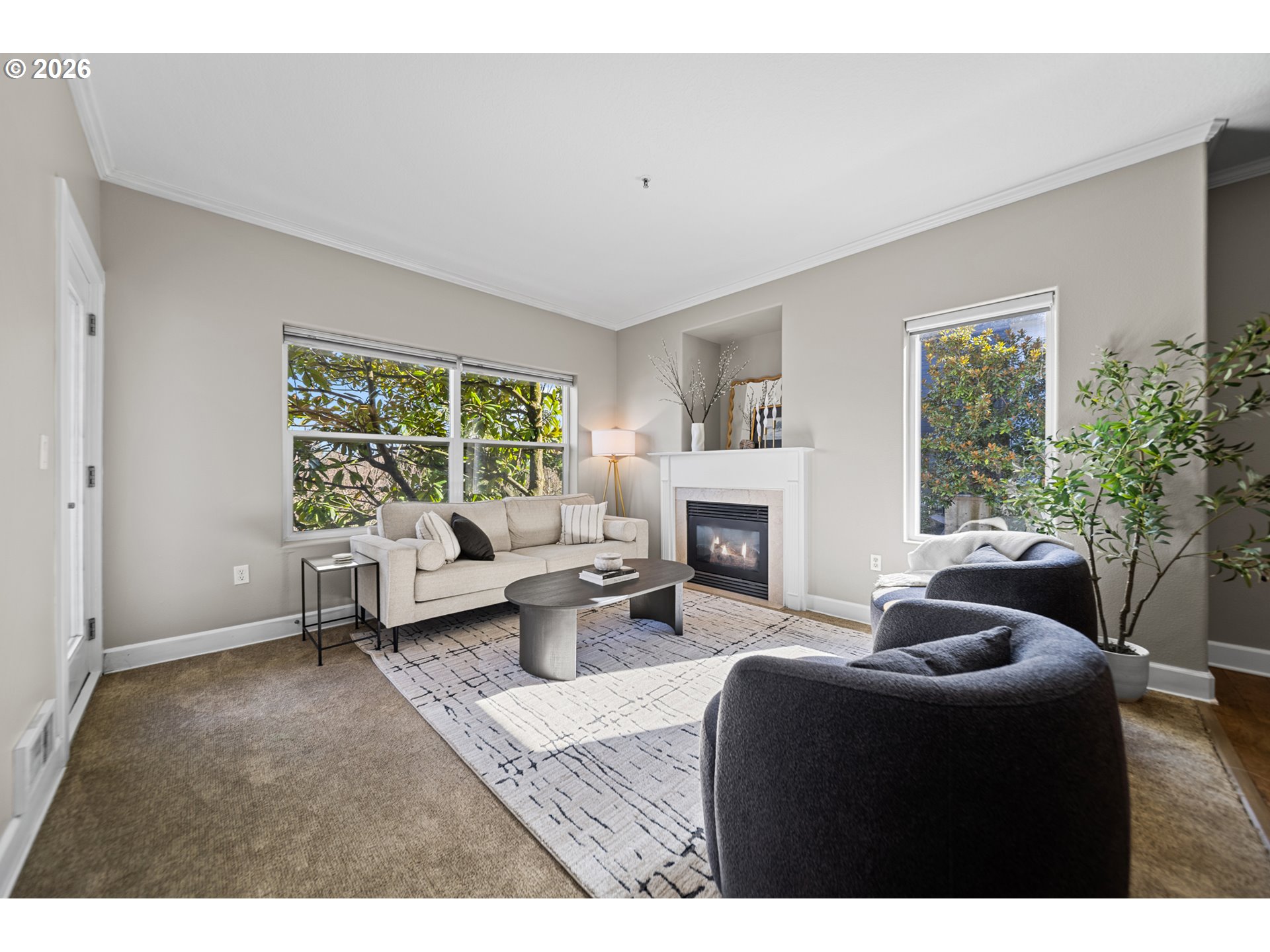 614 South Nevada Street, Unit B Portland, OR 97219 - Photo 10 of 29 a living room with furniture and a fireplace