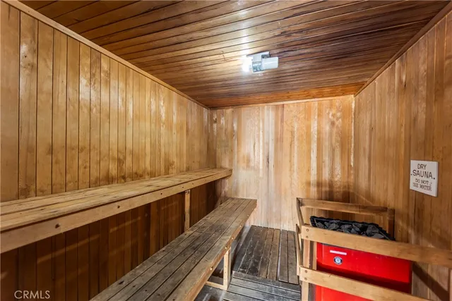 a view of a chairs and a table in the back yard of the building