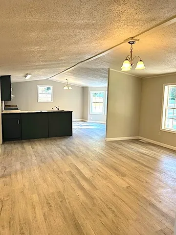 a view of a livingroom with wooden floor