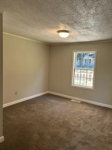 a view of kitchen with wooden floor and window