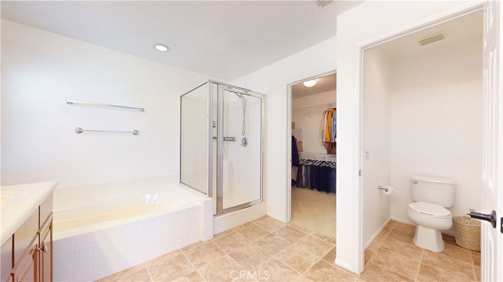 1279 Longbranch Road San Jacinto, CA 92582 - Photo 16 of 35 a bathroom with a tub shower and toilet