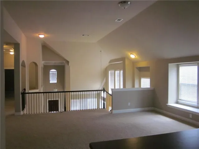 a view of a hallway with windows