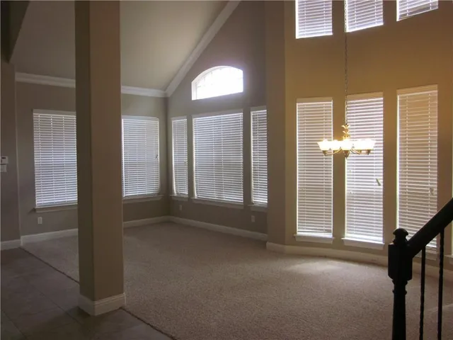 a view of empty room with windows