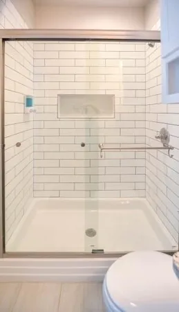 a bathroom with a bathtub and shower
