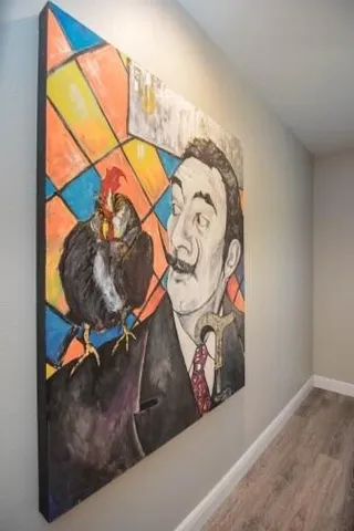 a bedroom with a bed and a chair