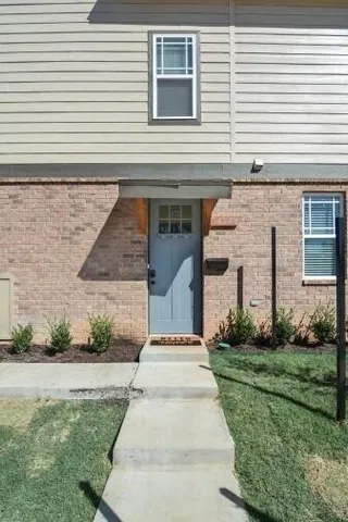 a view of building with yard