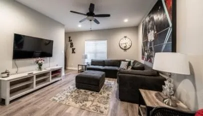 a living room with furniture and a flat screen tv
