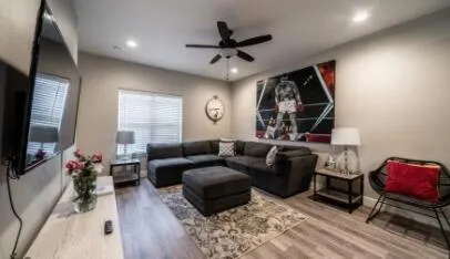 a living room with furniture and a flat screen tv