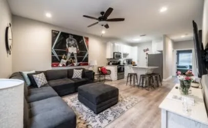 a living room with furniture and a large window