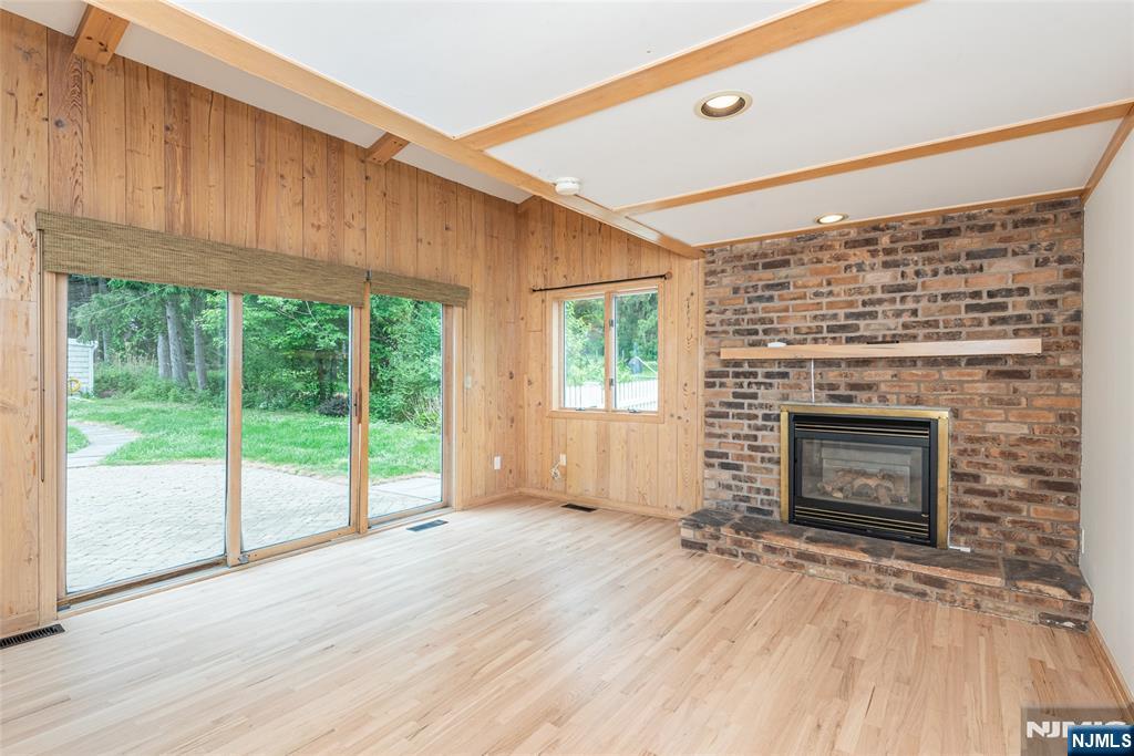163 Sand Spring Road Morristown, NJ 07960 - Photo 12 of 39 a view of an empty room with a fireplace and a window