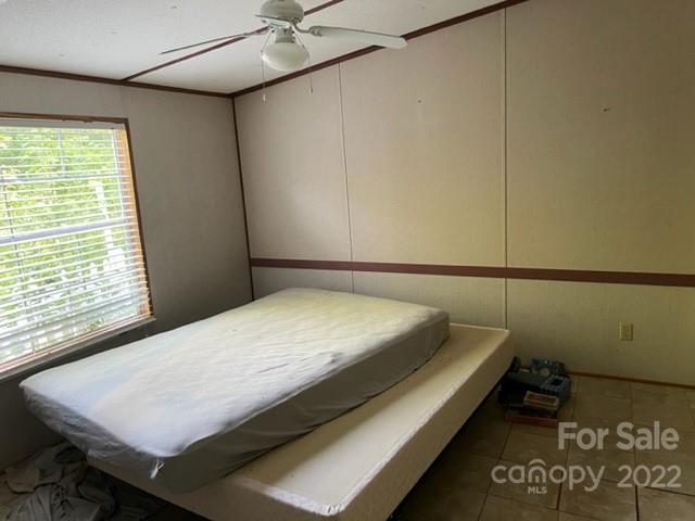 270 Adams Road Rutherfordton, NC 28139 - Photo 14 of 31 a bed sitting in a bedroom next to a window