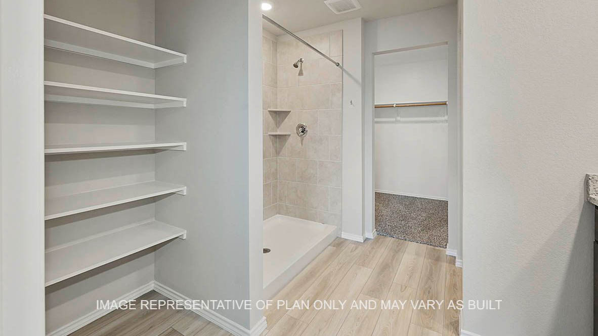 449 Combine Road Snook, TX 77879 - Photo 12 of 18 a bathroom with a bathtub and a shower