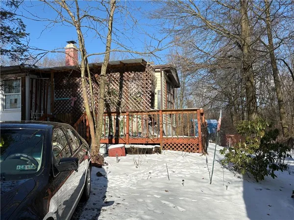a view of a wooden deck with a bench