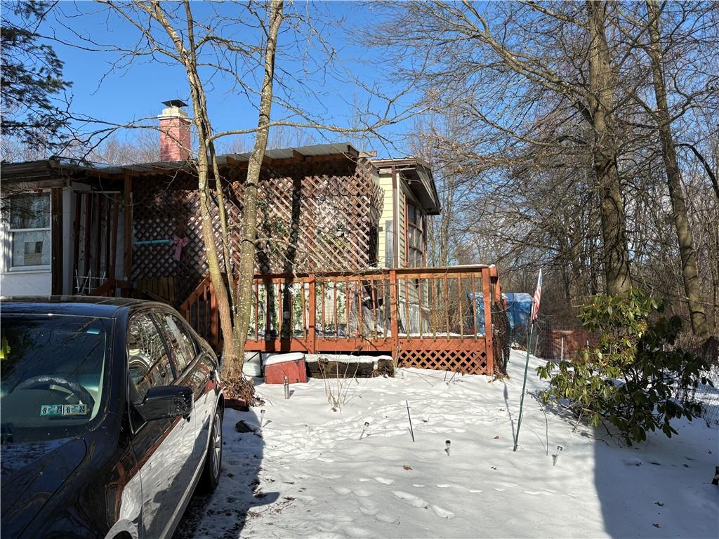 97 Orangeville Road Greenville, PA 16125 - Photo 3 of 8 a view of a wooden deck with a bench