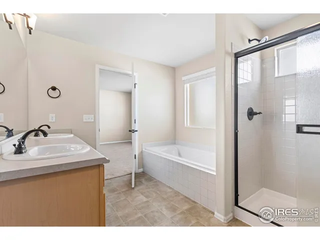 a bathroom with a sink a toilet a mirror and bathtub