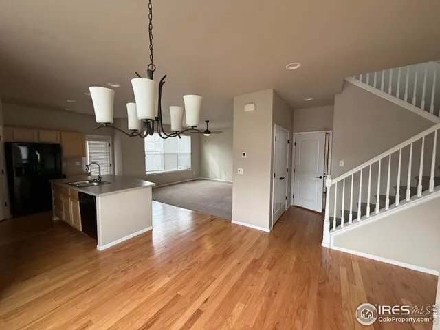 a view of kitchen with cabinets and wooden floor